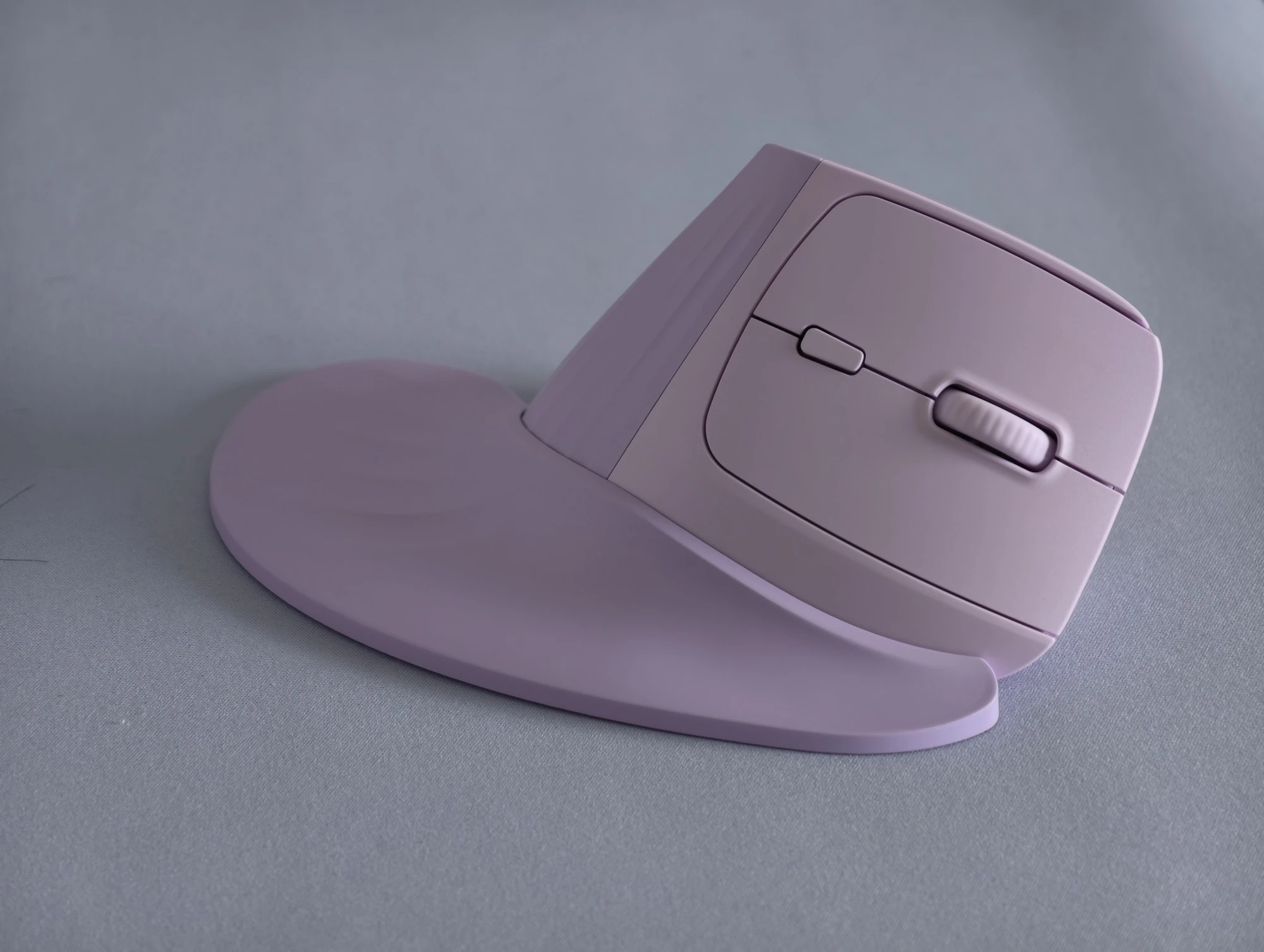 purple vertical mouse with a wrist rest attached