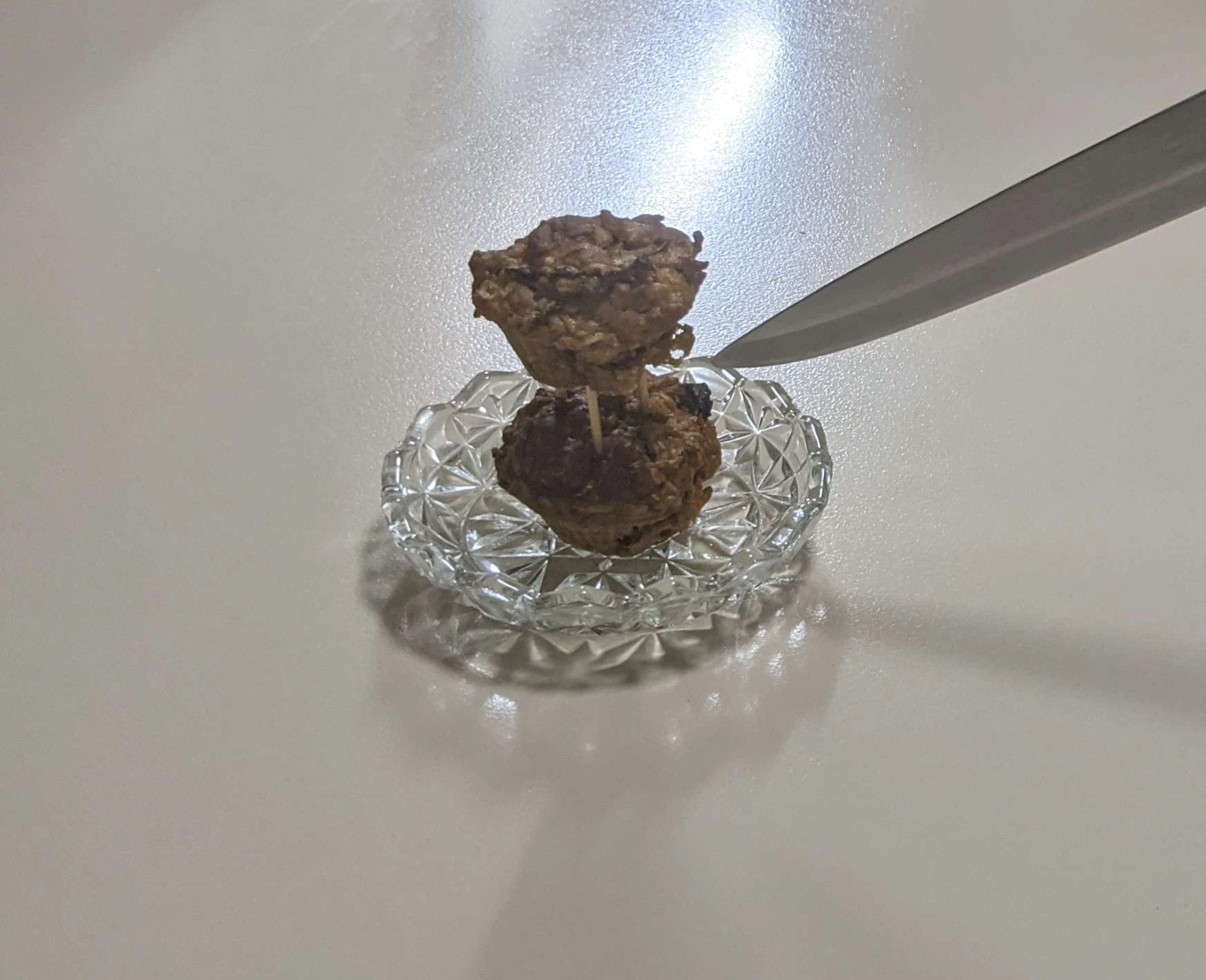 2 tiny muffins stacked with 3 toothpicks