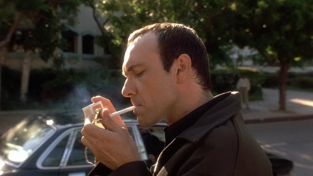 verbal kint from the usual suspects lighting a cigarette after being released by police in the final scene