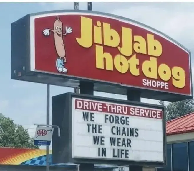 JibJab hot dog sign says 'we forge the chains we wear in life', a quote from Jacob Marley in A Christmas Carol, the first of four ghosts to visit Scrooge