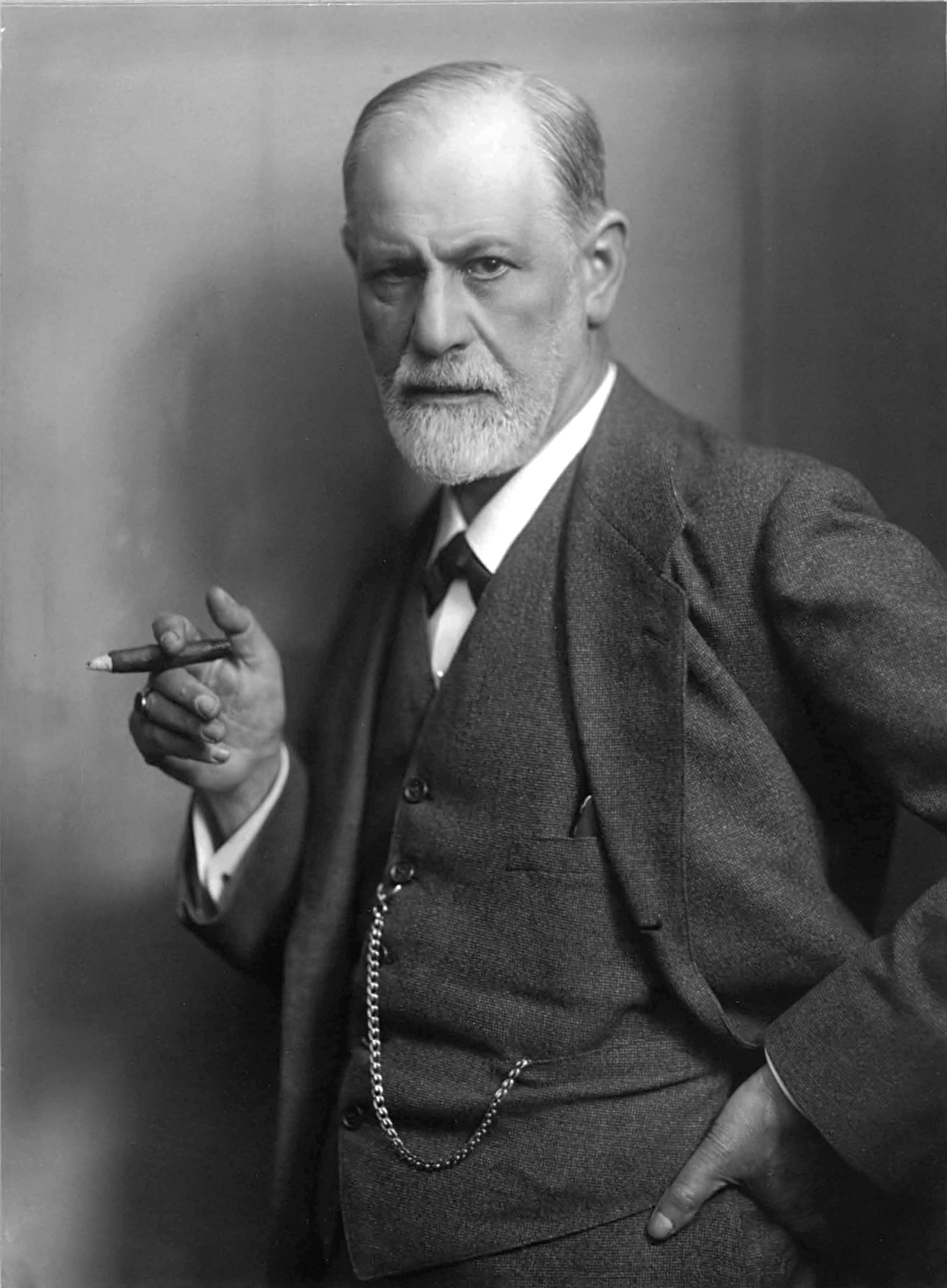 Photo of Sigmund Freud holding a cigar.