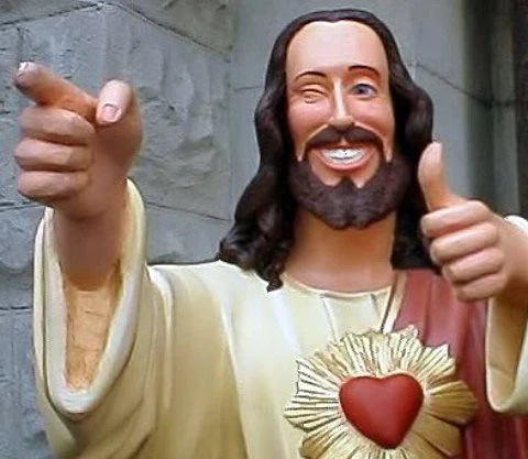 "Buddy Jesus" meme image. A statue of a pretty comical looking Jesus statue winking with a goofy grin making finger guns.