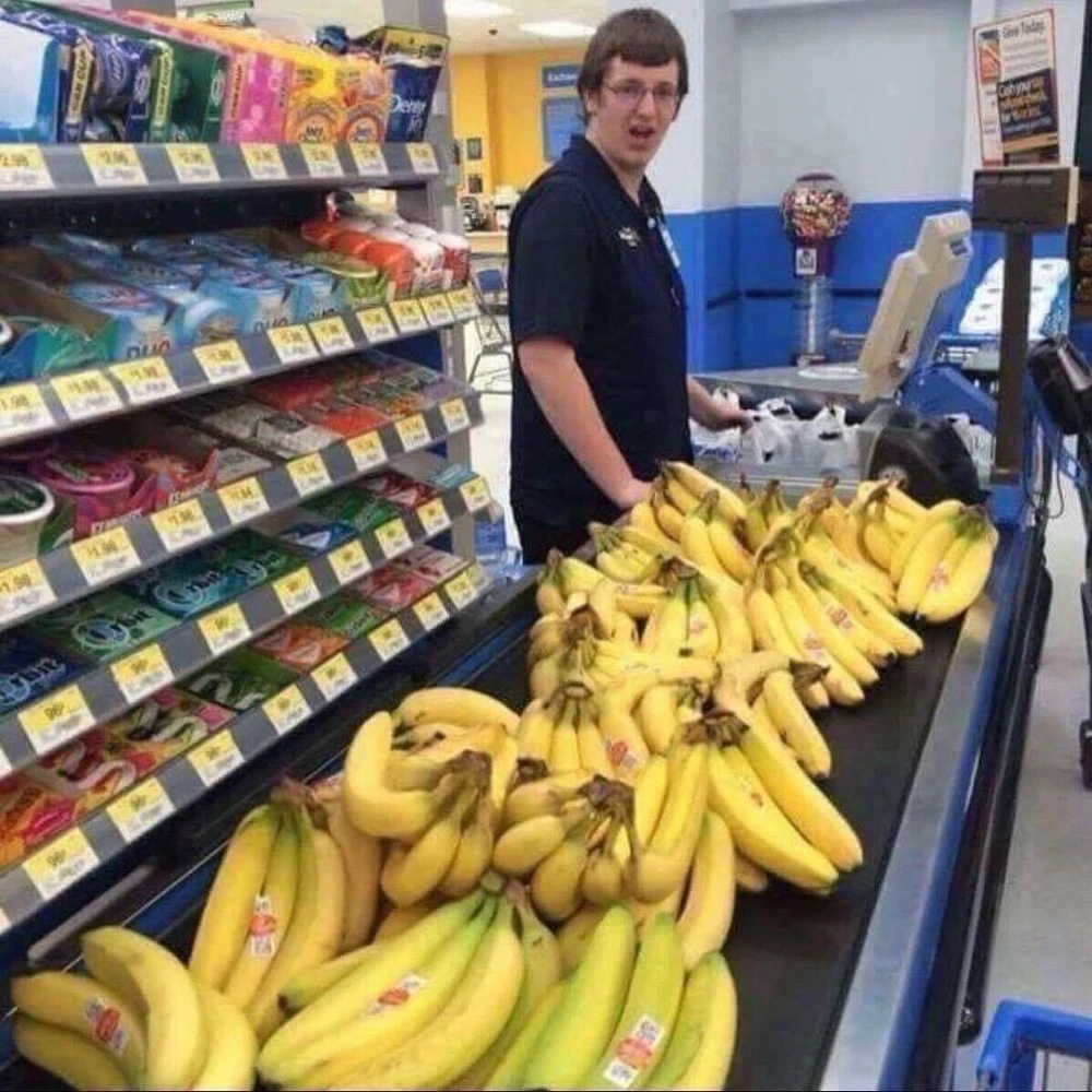 Too many bananas at conveyor belt at Walmart, cashier with a comically shocked expression 